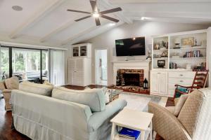 a living room with a couch and a fireplace at 106 Shore Rush Trail in Blackbanks