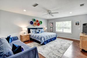 a bedroom with a bed and a couch at 106 Shore Rush Trail in Blackbanks