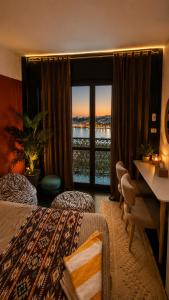 a hotel room with a view of the water at Aswan sunrise in Aswan