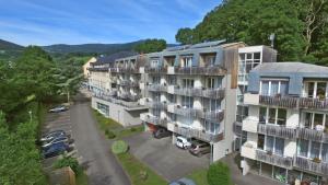 an aerial view of a building with a parking lot at VVF Alsace Orbey Colmar in Orbey