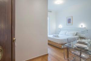 a bedroom with a bed and a glass table at Syntagma Gem 2 in Athens +16 photos