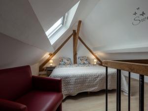 a bedroom with a bed with a window and a couch at Anc. Seigneurie de Boucaut in Leuze-en-Hainaut +117 photos
