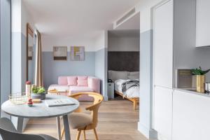 a living room with a table and a couch at Leman Locke in London +12 photos