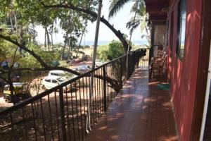 a balcony of a building with a view of a street at spectrum hub beach side apartment in Candolim
