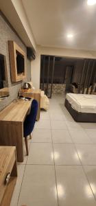 a large room with a bed and a desk and a bed sqor at Green Side Leon Hotel in Side +11 photos