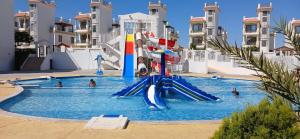 a water slide in a pool at a resort at Red Sea Serenity in Sharm El Sheikh