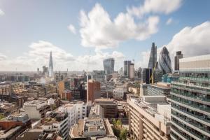 an aerial view of a city with tall buildings at Leman Locke in London