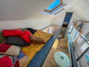 a large couch in a room with a glass floor at Ty Heole House in Plouézec +35 photos