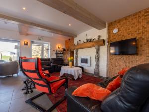 a living room with a couch and a fireplace at Anc. Seigneurie de Boucaut in Leuze-en-Hainaut