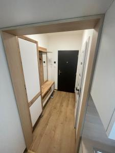 a hallway with a door open to a room at Apartmán Formula Trenčín in Trenčín