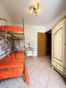 a room with two bunk beds and a table at Villa Calentana in Macari