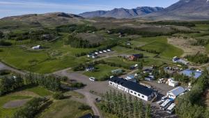 an aerial view of a farm with a building at Bakkaflöt Guesthouse in Varmahlid +77 photos