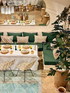 a restaurant with two tables with plates of food at Riad El Badun in Marrakesh