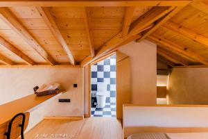 a room with a checkered tile on the wall at Terra Rossa in Plytra