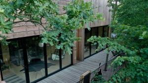 an external view of a building with glass windows at Wyszumiane in Staniszów +1 photo