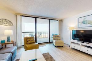a living room with a couch and a large screen tv at Pyramid 4G in Ocean City