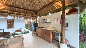 a kitchen with a counter and a microwave in a room at Amara Giri Ubud View Villas in Ubud