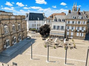 an aerial view of a city with buildings at Aux loges du théâtre in Moulins