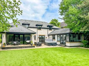 a large house with a lawn in front of it at Castlebar in Little Singleton