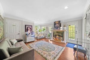 a living room with a couch and a fireplace at Royalty B&B in Richmond