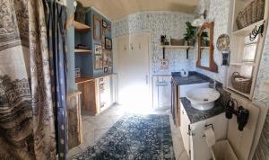 a bathroom with a sink and a mirror at Seelenversteck Oberaichwald in Latschach +37 photos