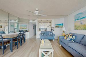 a living room with a blue couch and a table at Pyramid 6K in Ocean City