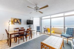 a living room with a table and chairs and a dining room at Pyramid 10C in Ocean City +12 photos