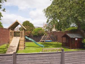 a backyard with a playground with a slide at Glaisdale in Pickering