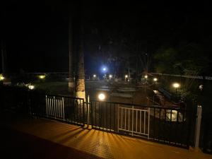 a view of a park at night with lights at Mountain Bliss Villa Gorai in Mumbai