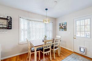 a dining room with a table and chairs at 838 Ocean Parkway in Ocean Pines