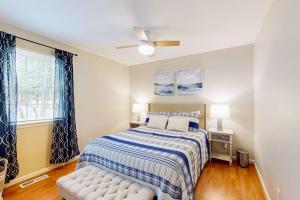 a bedroom with a bed and a ceiling fan at 838 Ocean Parkway in Ocean Pines
