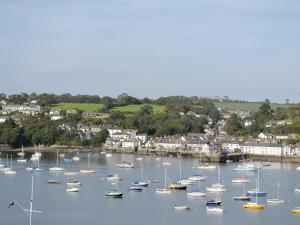 a bunch of boats are docked in a harbor at Tresidder Barn in Constantine