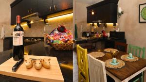 a kitchen with a table with a bottle of wine at Loft Giofiel in Santeagueda