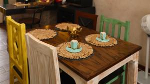a wooden table with four plates of food on it at Loft Giofiel in Santeagueda +2 photos