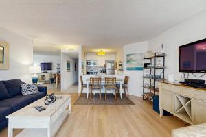a living room with a couch and a dining room at Pyramid 8K in Ocean City