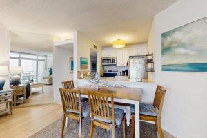 a kitchen and dining room with a table and chairs at Pyramid 8K in Ocean City