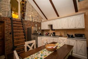 a kitchen with a table with a basket on it at Departamento Olivos 4 in Santeagueda