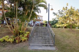 a set of stairs leading up to a building at Hotel Santa Amalia in Vassouras