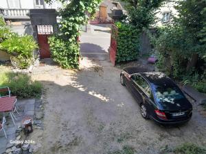 a car parked in the driveway of a house at Chambres d'hôtes de charme "La Tour Richelieu" in Martres-de-Veyre +15 photos