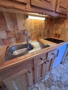 a kitchen with a sink and a counter top at Studio Croix Viallet, Chez Francine in Notre-Dame-de-Bellecombe +54 photos