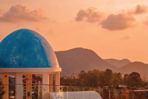 a building with a blue dome on top of it at Costa Village Jacuzzi Bangsaray in Bang Sare