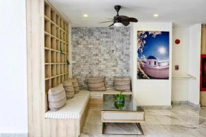 a living room with a couch and a table at Costa Village Jacuzzi Bangsaray in Bang Sare