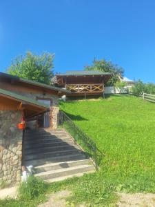 a set of stairs leading up to a building at Садиба Сузір'я in Vorokhta +6 photos