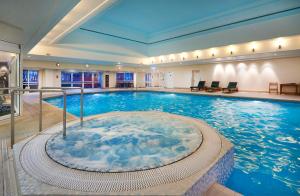 a large indoor swimming pool in a building at Orida Maidstone in Maidstone