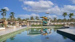a swimming pool with a slide in a resort at Beach GAV Resorts in Salinópolis +22 photos