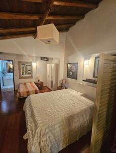 a bedroom with a large bed in a room at Casa da Minha Avó in São Pedro de Solis +24 photos