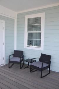 two chairs and a window on a porch at 2BR Cozy Cottage Private Dock in Davis
