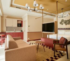 a living room with a couch and a bed at Homy Livia Verona in Verona