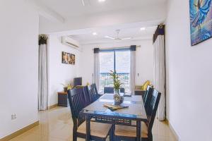 a dining room with a table and chairs at Lovish luxury villa in Colombo