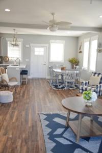an open living room with a table and chairs at Waterfront Home 3BR King bed Private Dock in Smyrna +28 photos